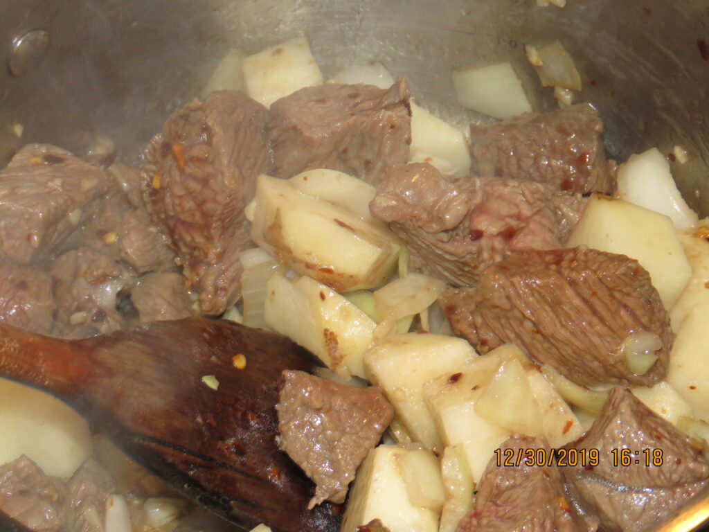 Beef and potatos browning for curry