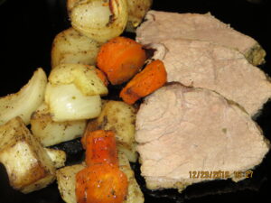 slices of beef with roasted veggies