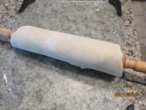 Rolling Pin with Rolled Dough