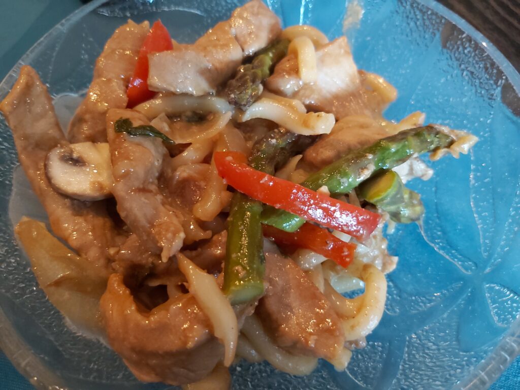 Stir Frying Pork and Asparagus with Noodles Bowl